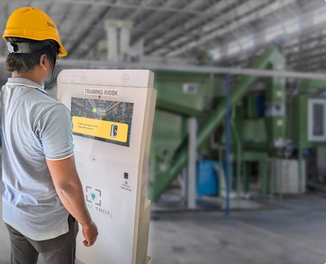 Britannia employee using a training kiosk in a production facility