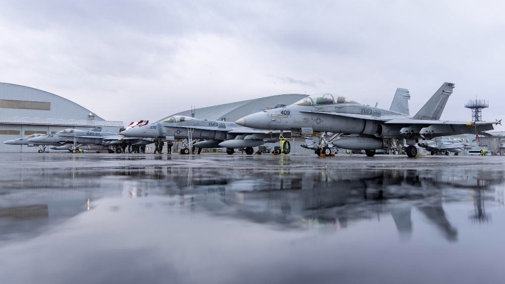 Military aircraft on a wet aerospace flight line